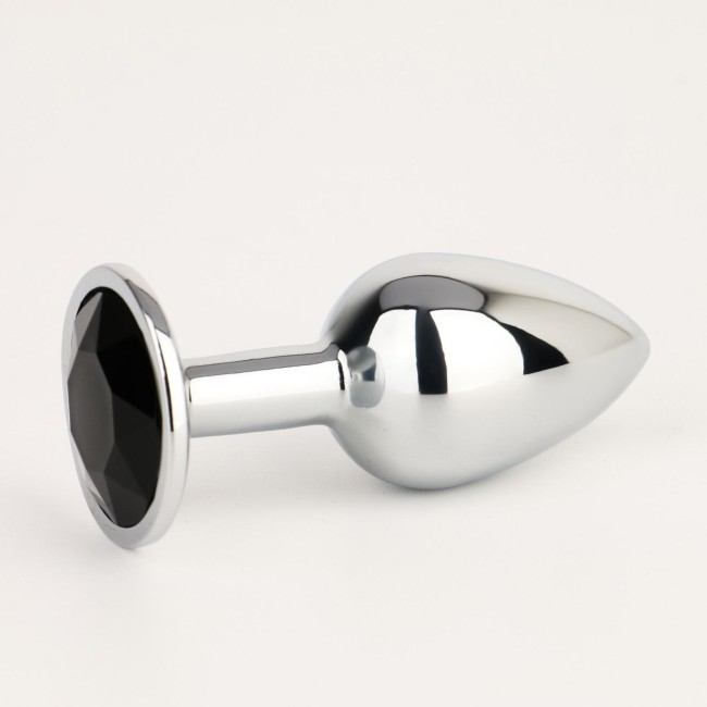 Серебристая анальная втулочка с черным кристаллом - 7 см. Серебристая анальная втулочка с черным кристаллом - 7 см.