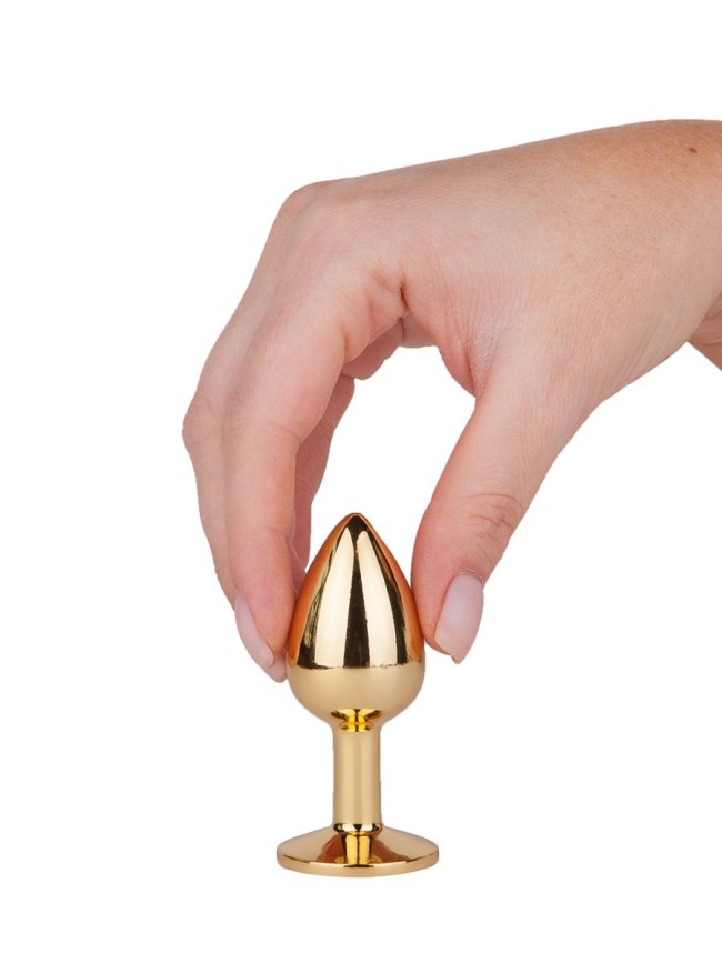 Золотистая анальная втулка с малиновым кристаллом - 7 см. Золотистая анальная втулка с малиновым кристаллом - 7 см.